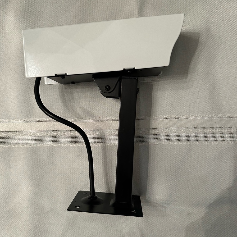 White and Black Wall-Mounted Security Camera